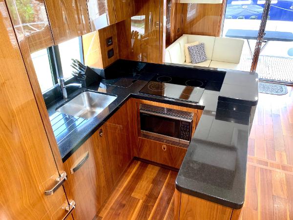 Slide: The Image of Luxurious kitchen in 2016 Sunseeker Manhattan 65 yacht with modern appliances and sleek design. - 6