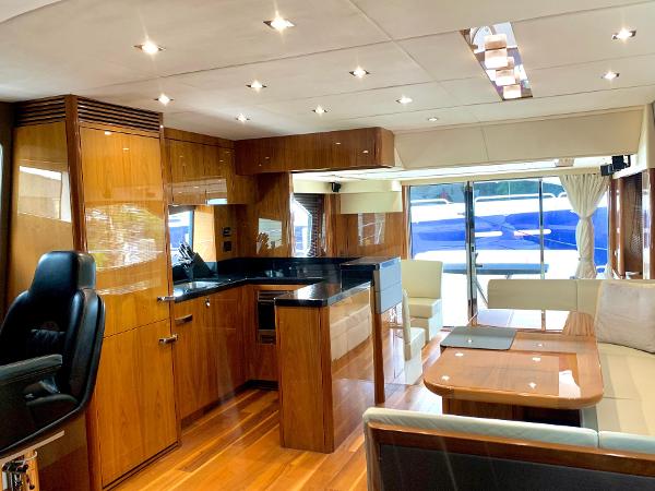 Slide: The Image of Luxurious interior of 2016 Sunseeker Manhattan 65 yacht with modern kitchen and dining area. - 8