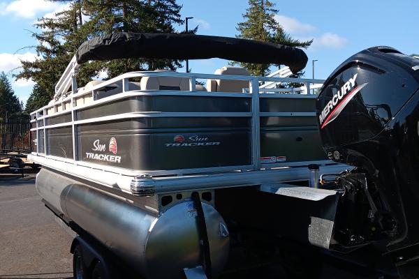 Slide: The Image of 2024 Sun Tracker Fishin' Barge 20 DLX pontoon boat with Mercury outboard motor. - 4