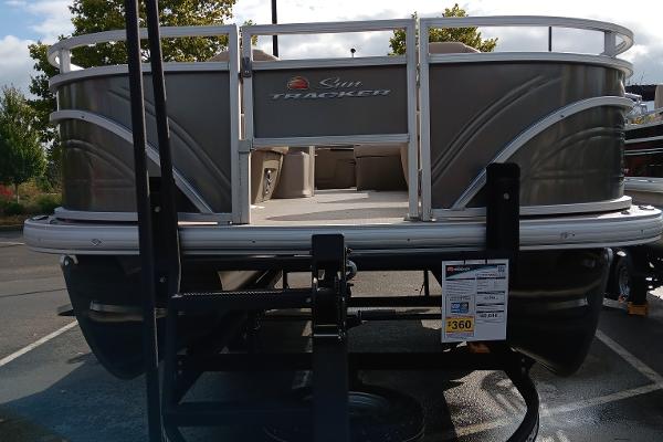Slide: The Image of 2024 Sun Tracker Fishin' Barge 20 DLX pontoon boat in parking lot. - 5