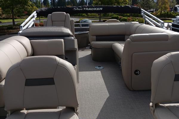 Slide: The Image of 2024 Sun Tracker Fishin' Barge 20 DLX interior with spacious seating and modern design. - 6