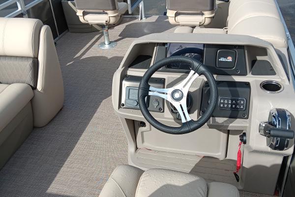Slide: The Image of 2024 Sun Tracker Fishin' Barge 20 DLX interior with steering console and seating. - 7
