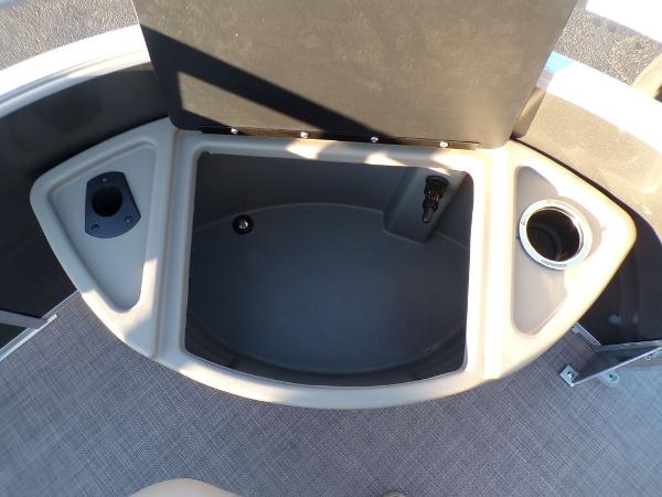 Slide: The Image of Open storage compartment on 2024 Sun Tracker FISHIN' BARGE® 22 DLX pontoon boat. - 10