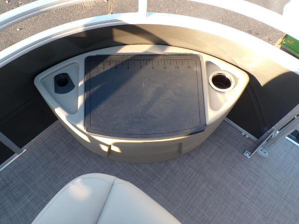 Slide: The Image of 2024 Sun Tracker FISHIN' BARGE® 22 DLX fishing station with cup holders and storage. - 14