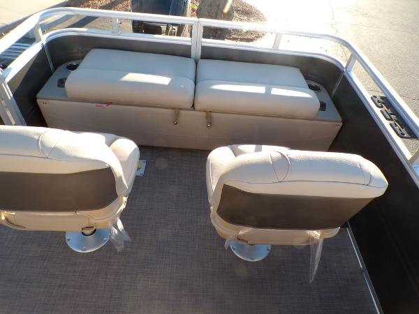 Slide: The Image of 2024 Sun Tracker FISHIN' BARGE® 22 DLX interior seating area. - 16