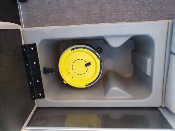 Slide: The Image of Built-in storage compartment on the 2024 Sun Tracker FISHIN' BARGE® 22 DLX. - 17