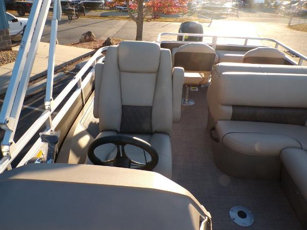 Slide: The Image of 2024 Sun Tracker FISHIN' BARGE® 22 DLX interior with captain's chair and seating. - 18