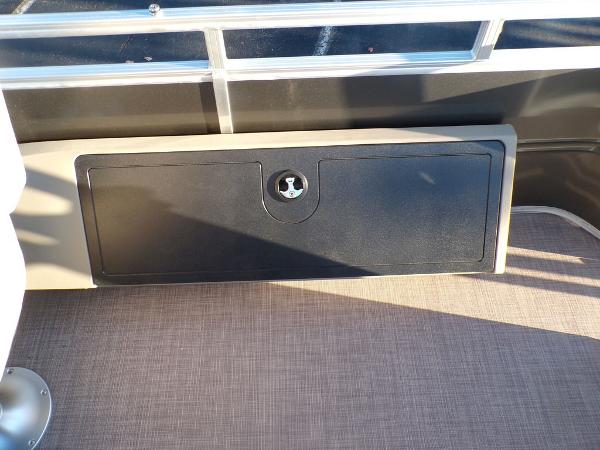 Slide: The Image of 2024 Sun Tracker FISHIN' BARGE® 22 DLX storage compartment on deck. - 22