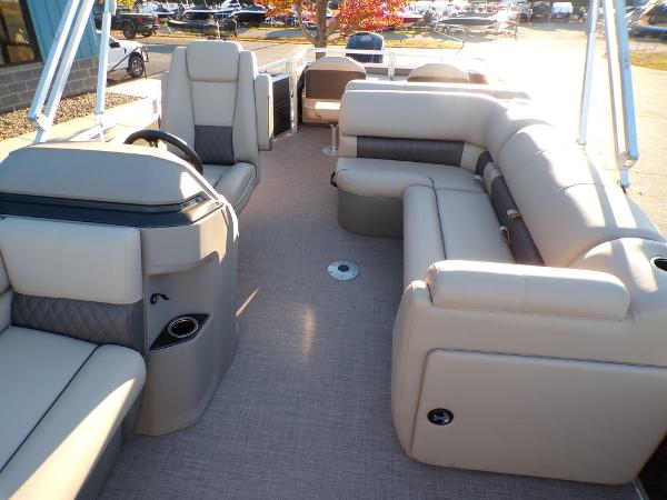 Slide: The Image of 2024 Sun Tracker FISHIN' BARGE® 22 DLX interior with spacious seating and modern design. - 9