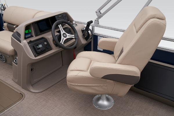 Slide: The Image of 2024 Sun Tracker Fishin' Barge 22 XP3 helm with beige captain's chair and control console. - 39