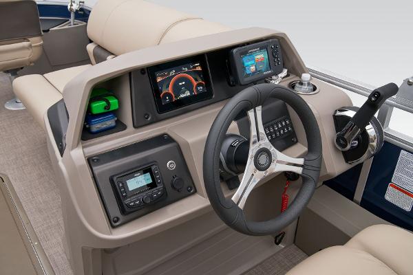 Slide: The Image of 2024 Sun Tracker Fishin' Barge 22 XP3 helm with modern controls and navigation displays. - 45