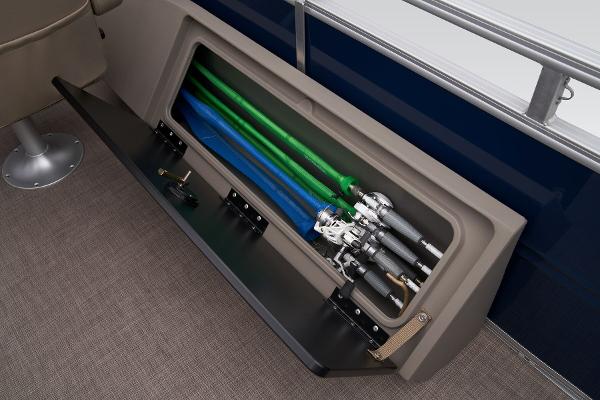 Slide: The Image of 2024 Sun Tracker Fishin' Barge 22 XP3 rod storage compartment with fishing rods. - 49