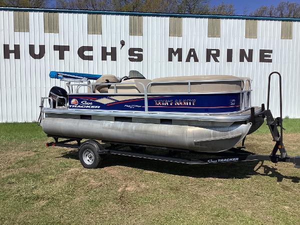 Slide: The Image of 2018 Sun Tracker Party Barge 18 DLX pontoon boat on trailer at Hutch's Marine. - 1