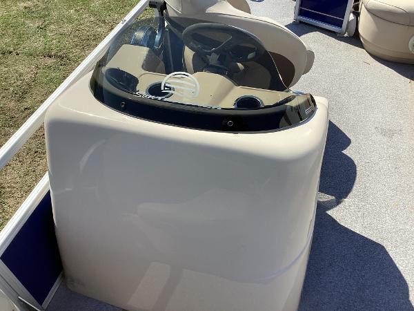 Slide: The Image of 2018 Sun Tracker Party Barge 18 DLX helm station with steering wheel and controls. - 10