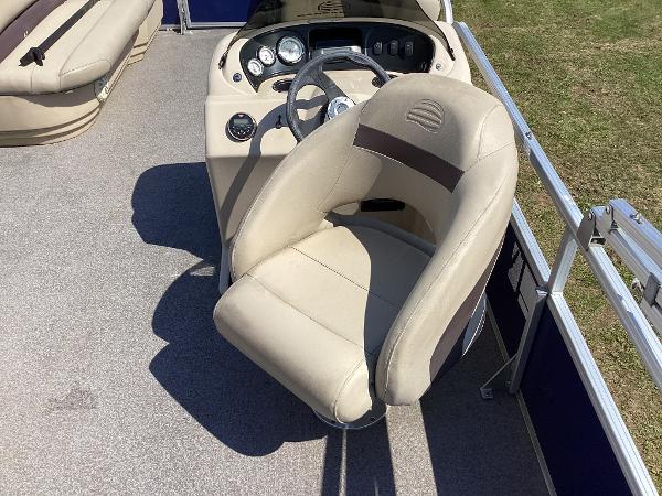 Slide: The Image of 2018 Sun Tracker Party Barge 18 DLX captain's chair and helm station. - 5