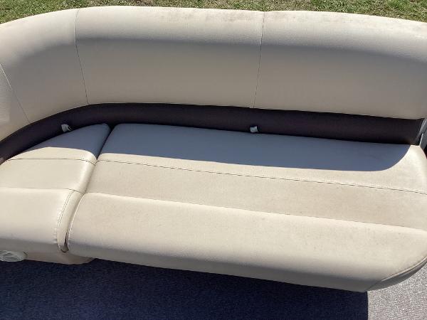 Slide: The Image of Sun Tracker Party Barge 18 DLX 2018 beige cushioned seating on pontoon boat. - 8