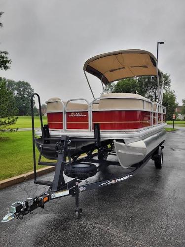 Slide: The Image of 2024 Sun Tracker Party Barge 18 DLX pontoon boat on trailer. - 1