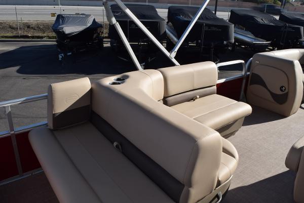 Slide: The Image of 2024 Sun Tracker Party Barge 18 DLX interior seating area with beige upholstery. - 3