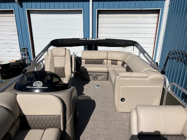 Slide: The Image of 2023 Sun Tracker PARTY BARGE® 20 DLX pontoon boat interior with beige seating. - 1