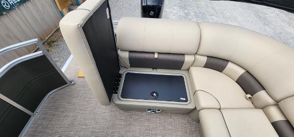 Slide: The Image of Sun Tracker PARTY BARGE® 20 DLX 2024 interior seating with storage compartment. - 13