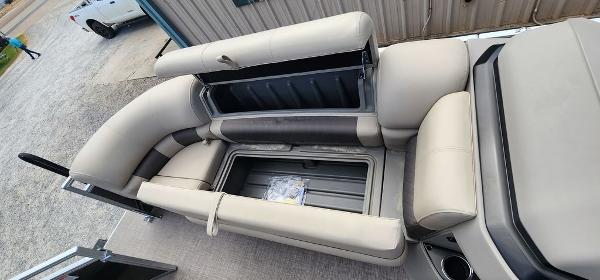 Slide: The Image of 2024 Sun Tracker PARTY BARGE® 20 DLX pontoon boat with open storage compartments. - 15