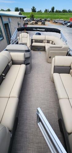 Slide: The Image of 2024 Sun Tracker PARTY BARGE® 20 DLX interior with beige seating and spacious layout. - 20
