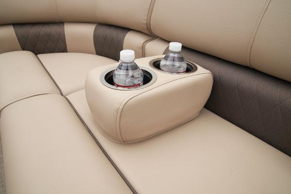 Slide: The Image of Sun Tracker Party Barge 20 DLX 2024 interior with cup holders and water bottles. - 28