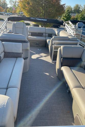 Slide: The Image of 2024 Sun Tracker Party Barge 20 DLX pontoon boat interior with spacious seating. - 3