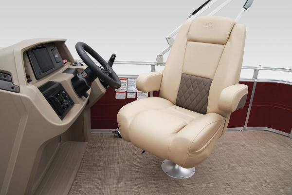Slide: The Image of Captain's chair and helm of the 2024 Sun Tracker Party Barge 20 DLX pontoon boat. - 32