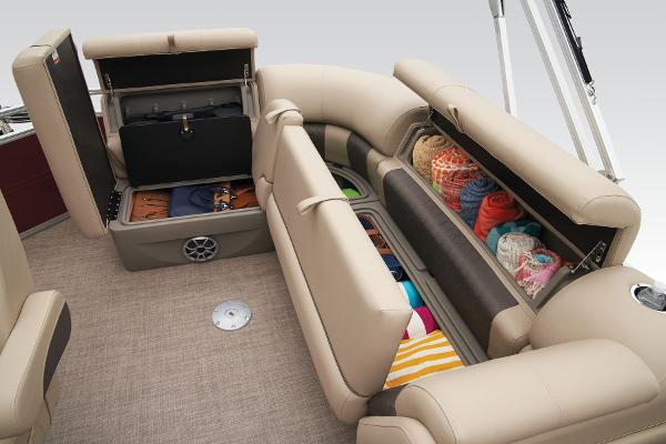 Slide: The Image of 2024 Sun Tracker Party Barge 20 DLX interior storage compartments filled with various items. - 40