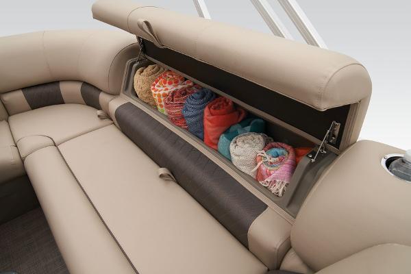 Slide: The Image of 2024 Sun Tracker Party Barge 20 DLX storage compartment with rolled towels. - 44