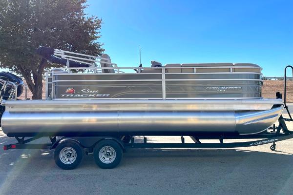 Slide: The Image of 2024 Sun Tracker Party Barge 20 DLX pontoon boat on a trailer. - 49