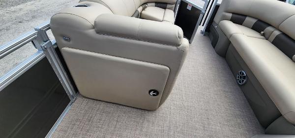 Slide: The Image of 2024 Sun Tracker PARTY BARGE® 20 DLX interior with beige seating and carpeted floor. - 7