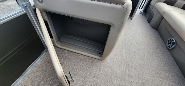 Slide: The Image of 2024 Sun Tracker PARTY BARGE® 20 DLX interior storage compartment. - 8