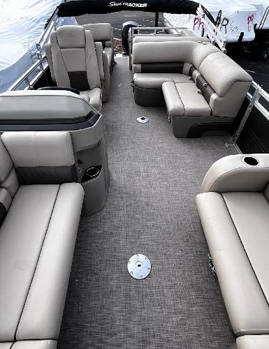 Slide: The Image of 2024 Sun Tracker Party Barge 22 RF DLX interior with spacious seating and modern design. - 2