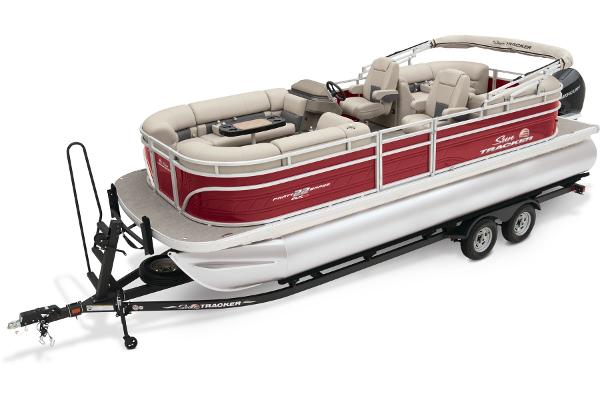 Slide: The Image of 2024 Sun Tracker Party Barge 22 XP3 pontoon boat on trailer, red and white. - 0