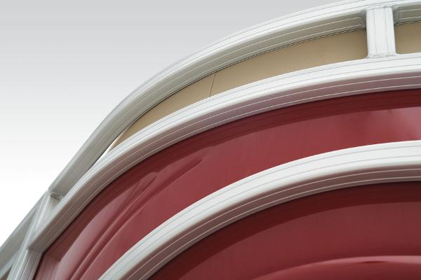 Slide: The Image of Close-up of 2024 Sun Tracker Party Barge 22 XP3 red exterior detailing. - 10