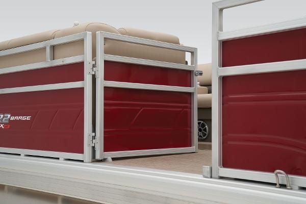 Slide: The Image of 2024 Sun Tracker Party Barge 22 XP3 pontoon boat with red side panels and beige seating. - 15
