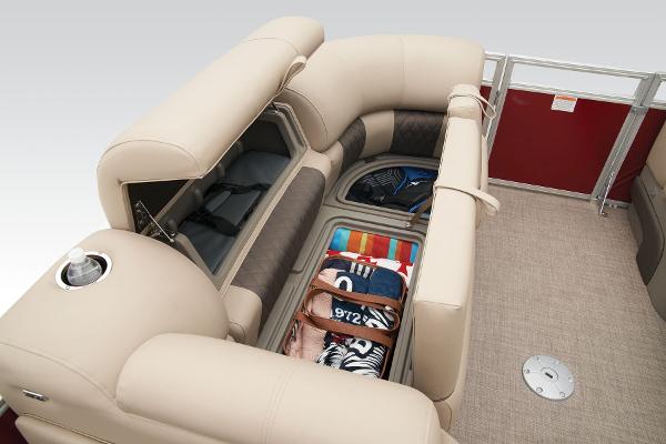 Slide: The Image of 2024 Sun Tracker Party Barge 22 XP3 storage compartments with beige seating. - 16