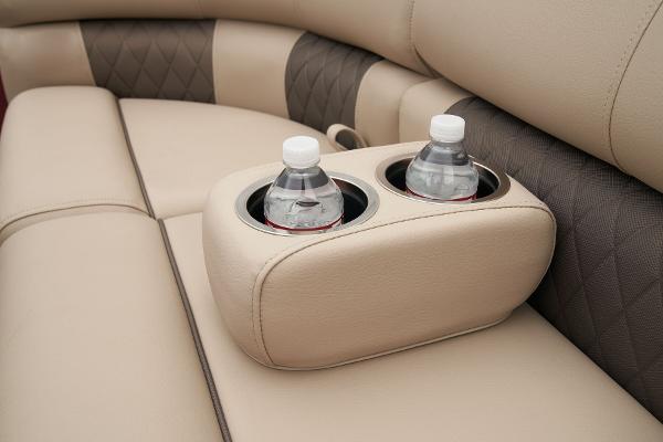 Slide: The Image of 2024 Sun Tracker Party Barge 22 XP3 cup holders on beige seating. - 18