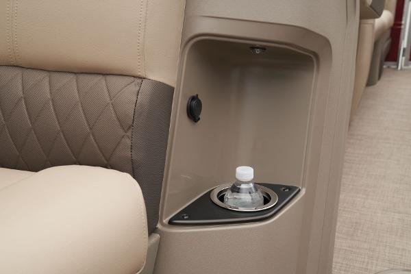 Slide: The Image of 2024 Sun Tracker Party Barge 22 XP3 interior cup holder and storage compartment. - 20
