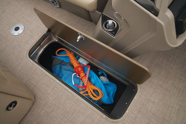 Slide: The Image of Storage compartment on 2024 Sun Tracker Party Barge 22 XP3 with boating gear. - 24
