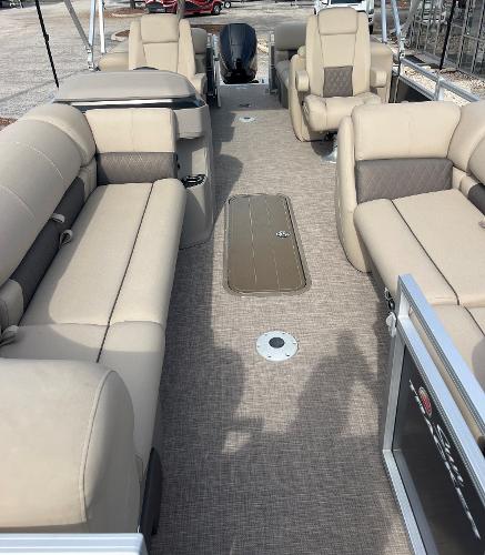 Slide: The Image of 2024 Sun Tracker Party Barge 22 XP3 interior with beige seating and spacious layout. - 3