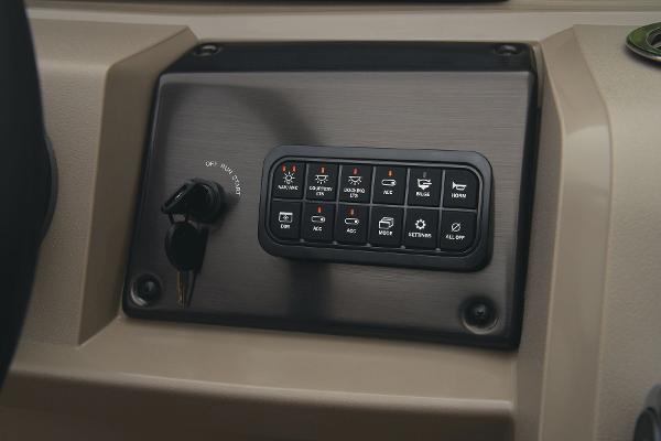 Slide: The Image of Control panel of 2024 Sun Tracker Party Barge 22 XP3 with ignition key and switches. - 36