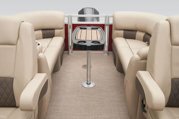 Slide: The Image of 2024 Sun Tracker Party Barge 22 XP3 interior with beige seating and central table. - 40