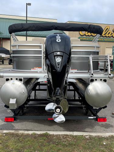 Slide: The Image of 2024 Sun Tracker Party Barge 24 DLX pontoon boat with outboard motor. - 1