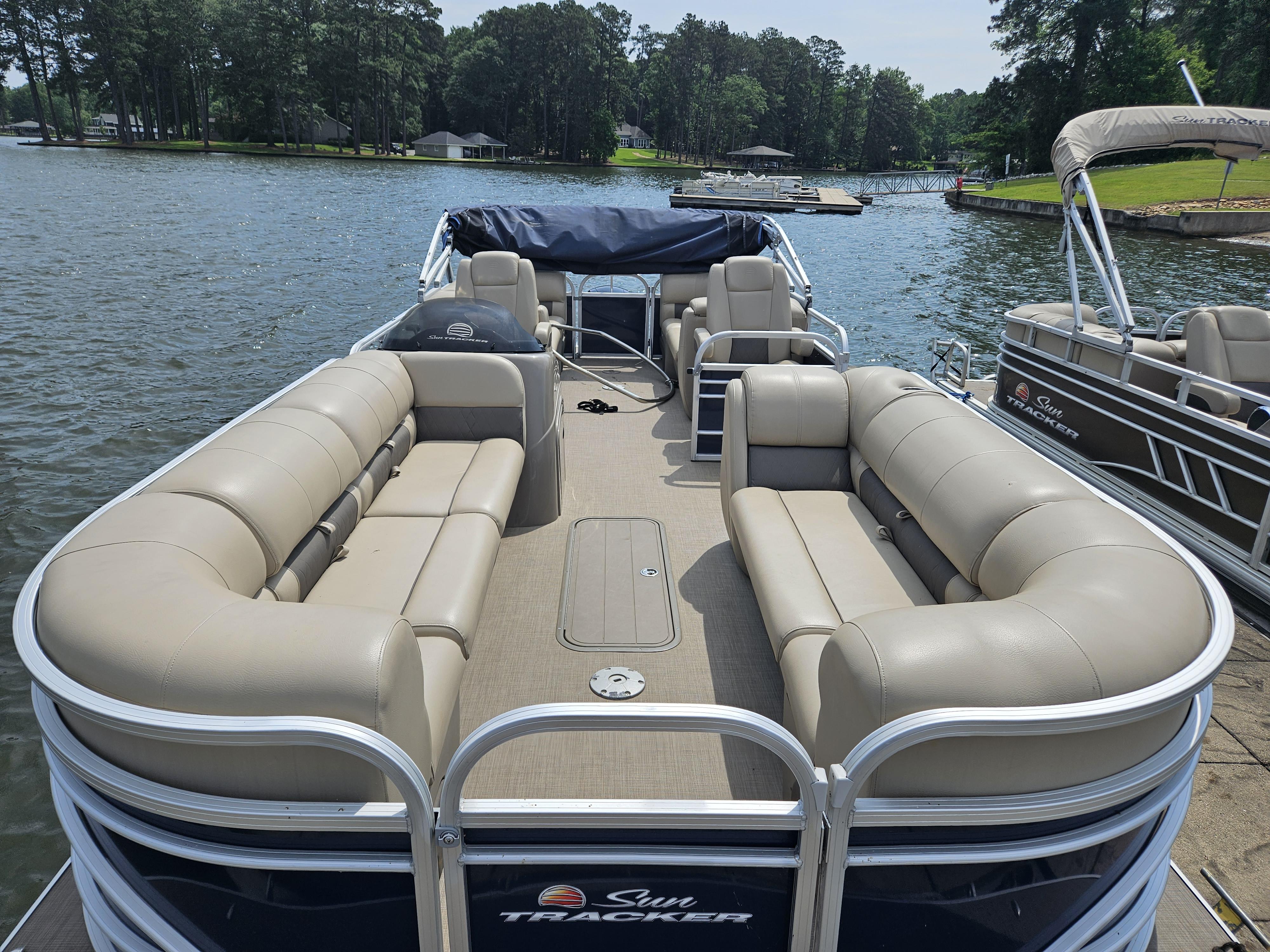 Slide: The Image of 2021 Sun Tracker Party Barge 24 XP3 pontoon boat on a lake. - 7