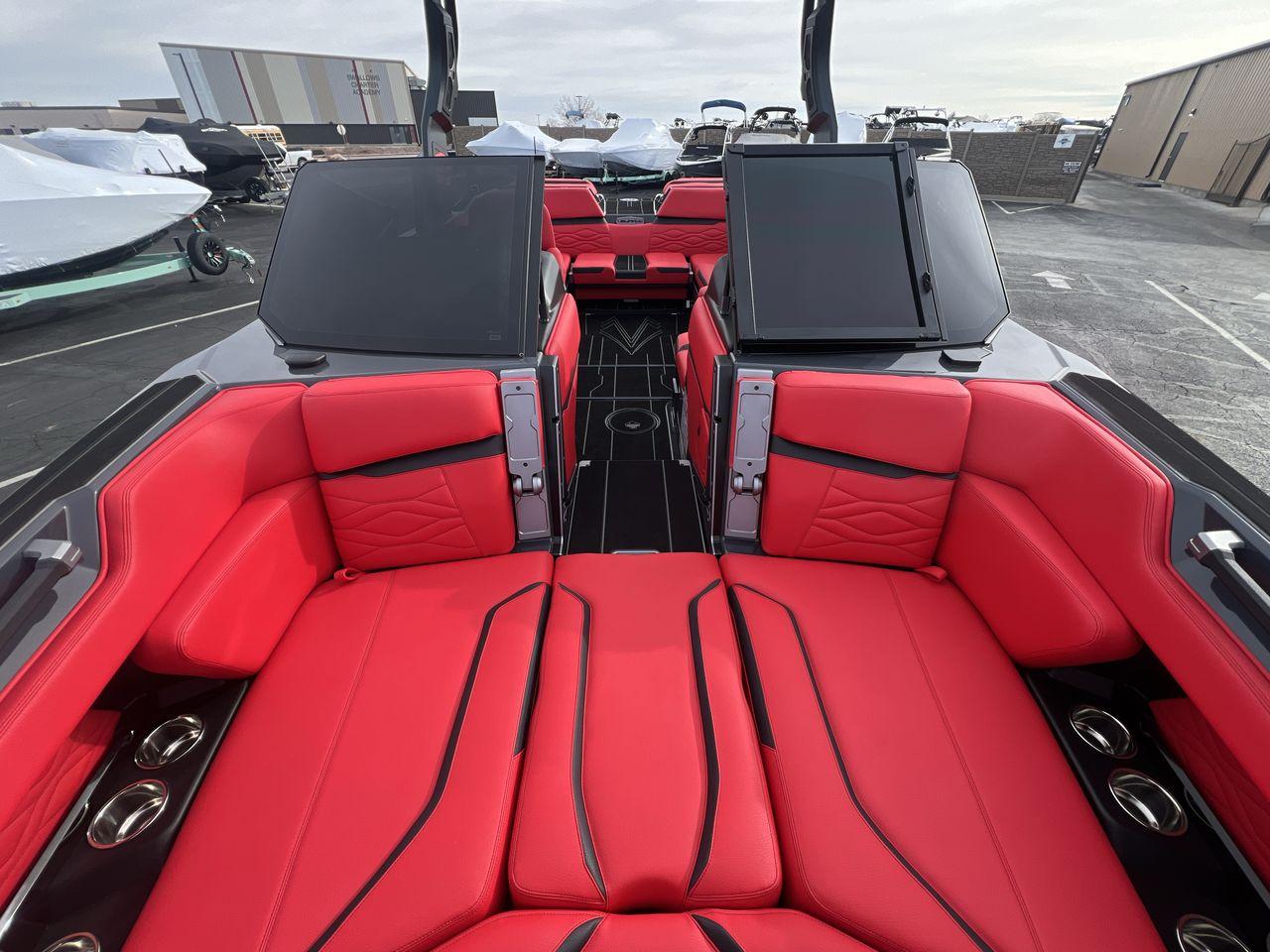 Slide: The Image of 2025 Supra SA boat interior with luxurious red seating and sleek design. - 12