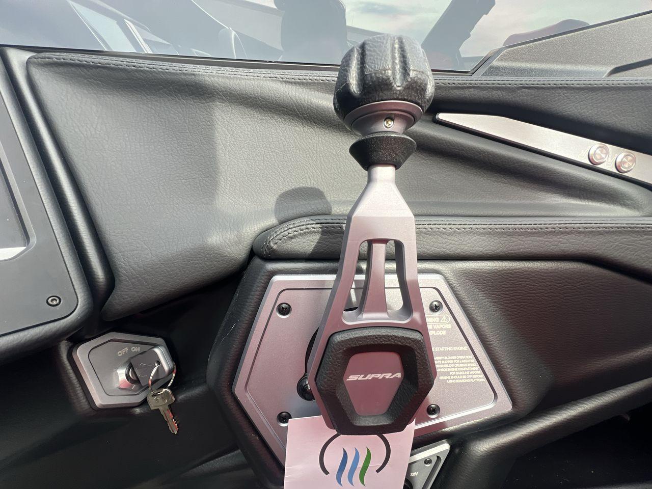 Slide: The Image of 2025 Supra SA interior with gear shift and ignition key. - 16