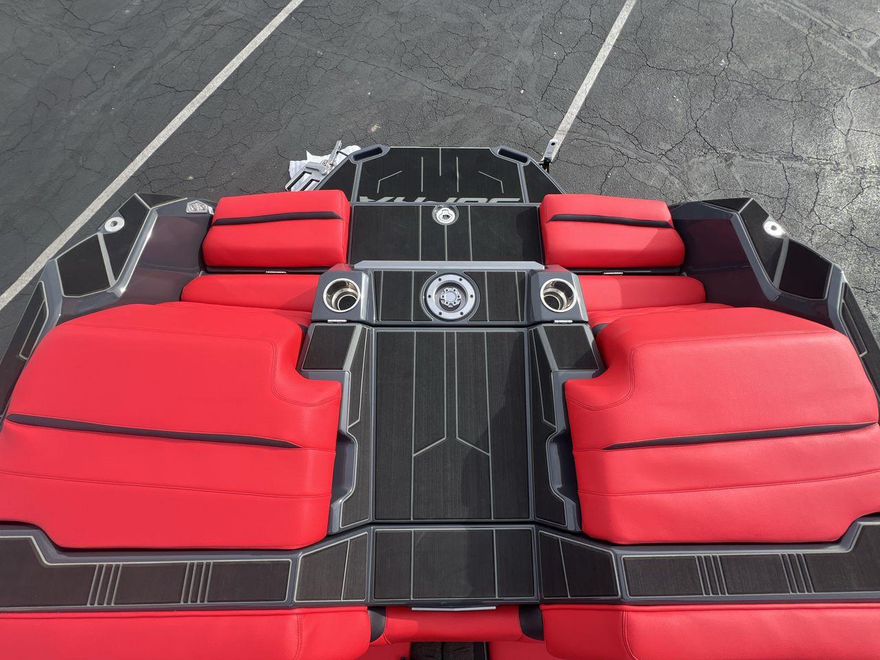 Slide: The Image of 2025 Supra SA boat interior with red seats and sleek black detailing. - 19